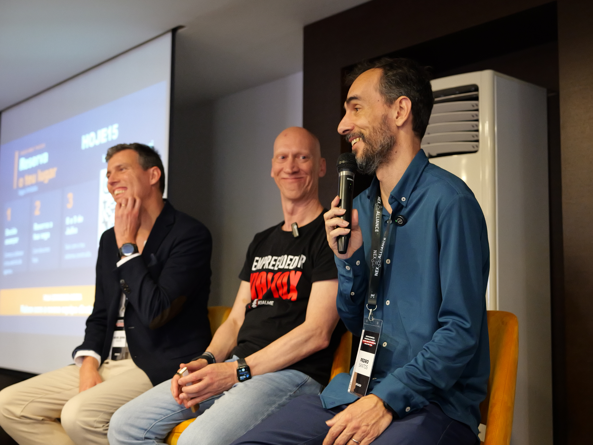 Os três no palco do último evento